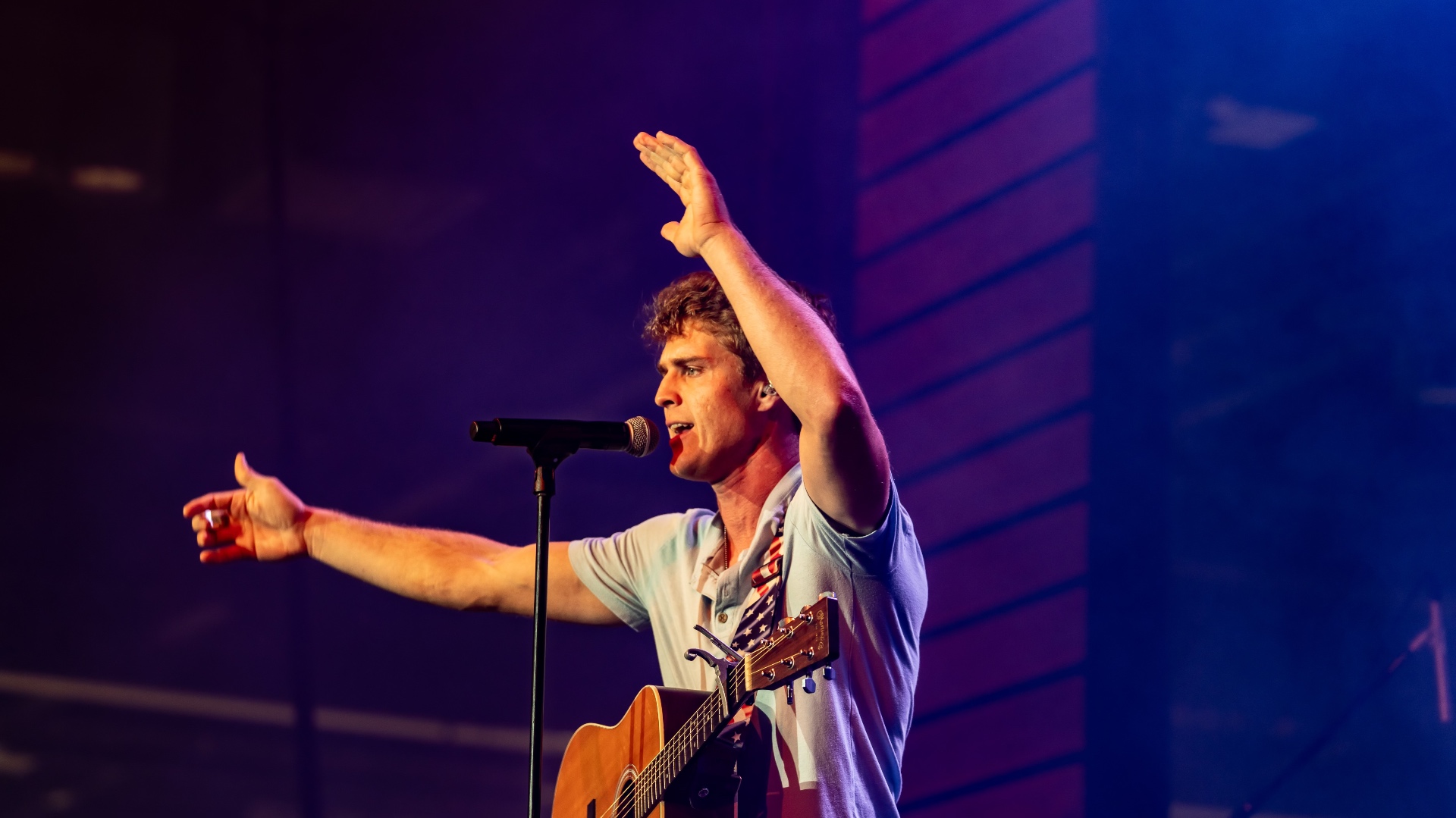 Michael Patrick Joyce reaching out to the crowd mid-performance